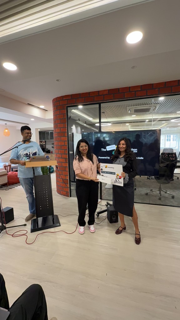 Ankita Satpathy with The Wellness Loop award at IndeHub Hackathon 2026